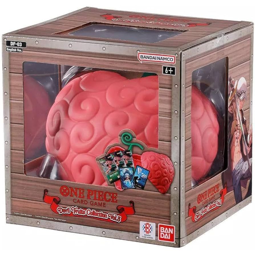 The One Piece Card Game: Devils Fruit Collection Vol. 3 by Bandai includes a large pink swirled Devil Fruit replica and collectible cards, with packaging showing an age recommendation of 6+.