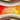 Image displays multiple Magic the Gathering: Jumpstart Booster Display packs by Wizards of the Coast in a circle, with bold center text: 24 Jumpstart Booster Packs, 20 Cards Per Pack—perfect for any collection. Red and orange background.