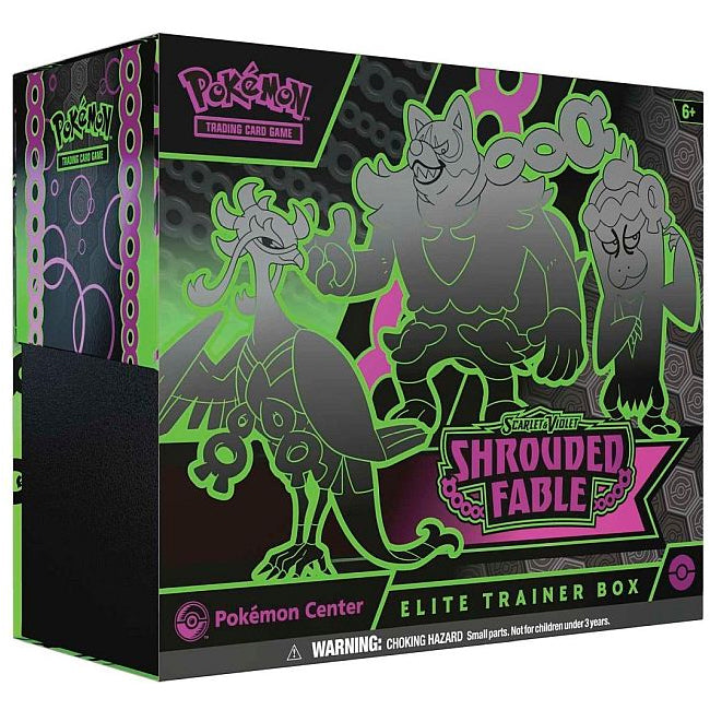 The image shows The Pokémon Company’s Pokémon TCG: Shrouded Fable Pokemon Center Elite Trainer Box, with neon green and magenta art of three Pokémon on a black background, plus logos and a warning label at the bottom.