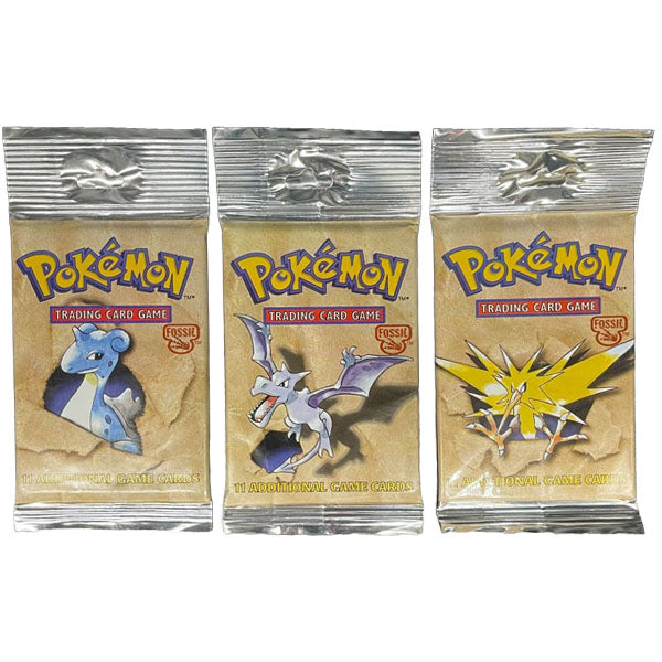 Three sealed Pokémon TCG: Fossil Booster Pack - Unlimited (Long Crimp) boosters from The Pokémon Company are shown, each featuring unique Lapras, Aerodactyl, and Zapdos artwork on a sandy background. All packs are uvejet and ideal for collectors.