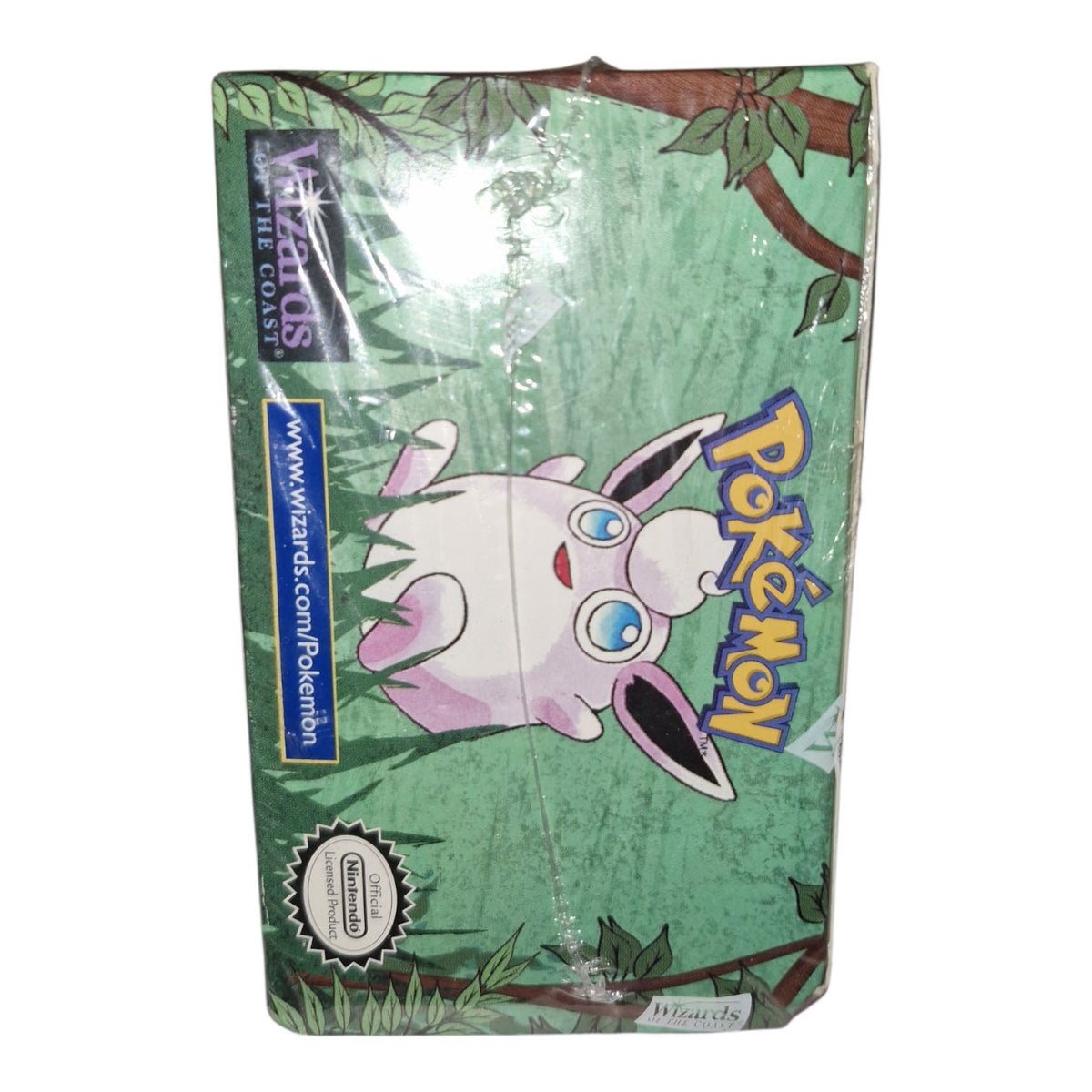 A sealed 1st Edition Pokémon TCG: Jungle Booster Box from The Pokémon Company, featuring leafy artwork and Jigglypuff on the cover, plus Wizards of the Coast and Nintendo logos.