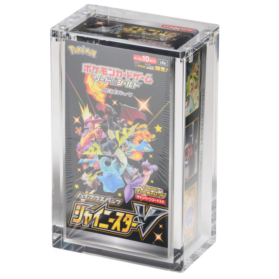 Black box packaging for The Acrylic Box: Pokémon Booster Box (Japansk) by The Pokémon Company, featuring an acrylic case designed for Japanese Pokémon booster boxes and enhanced with orange and white design accents. The packaging text highlights premium acrylic protection and compatibility, making it the ideal choice for collectors seeking a stylish and secure solution to display or store their Japanese Pokémon booster box.