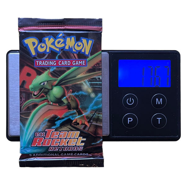 A Pokémon TCG: EX Team Rocket Returns Booster Pack - Heavy (EX Ruby & Sapphire) by The Pokémon Company is weighed at 17.67 grams on a digital scale—perfect for collectors seeking potential holo or Gold Star cards.