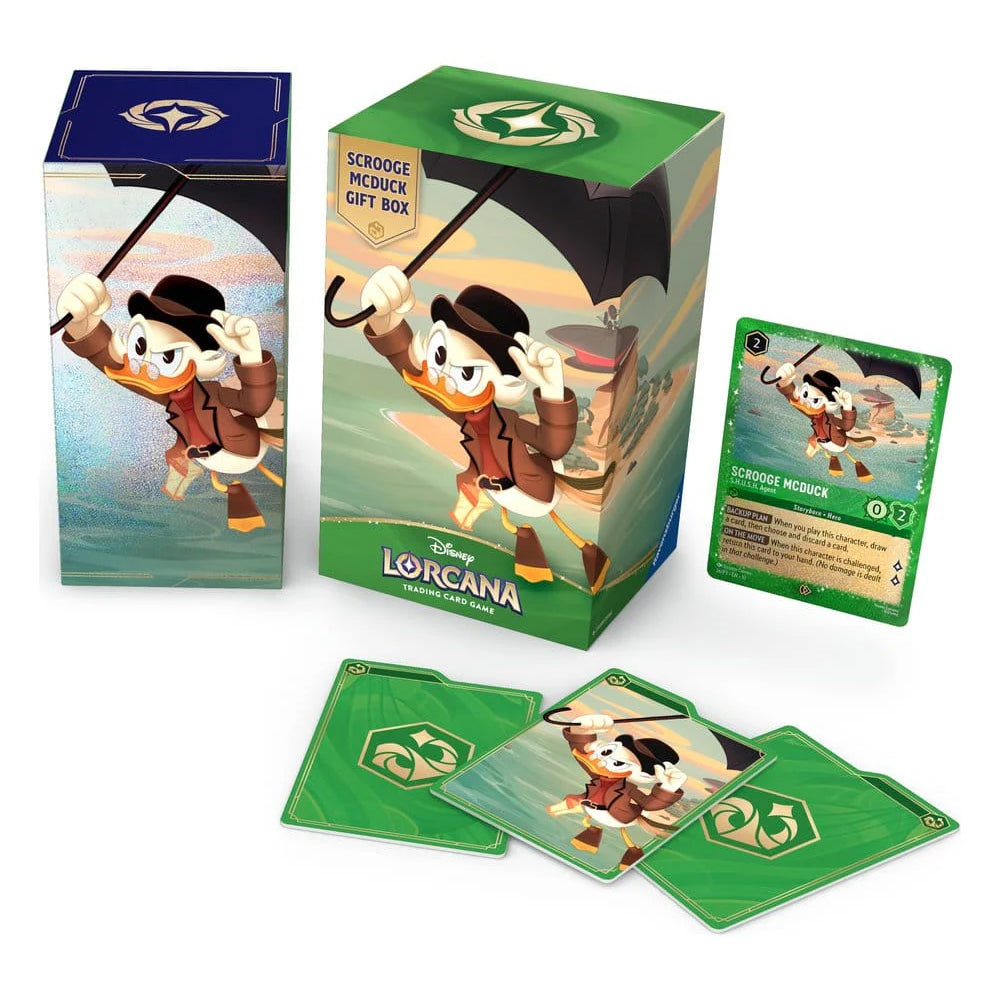 Ravensburger’s Disney Lorcana: Scrooge McDuck Gift Set features eye-catching artwork of Scrooge McDuck confidently standing atop a pile of gold coins, holding his iconic umbrella and cane. The packaging displays the set name: “Scrooge McDuck Gift Set.”.