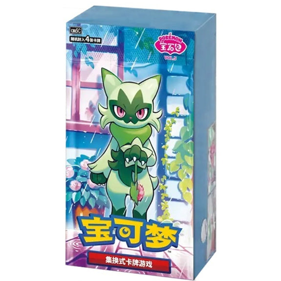 The Pokémon TCG: Gem Pack Vol. 5 Booster Box (Kinesisk) by The Pokémon Company features a vibrant box with a green, cat-like Pokémon with big eyes and a leafy collar amid plants, colorful Chinese text, and the Pokémon logo in the top right corner.