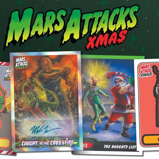 Topps Mars Attacks XMAS 2026 Hobby Box featuring a skeletal alien wearing a Santa hat and beard, holding a futuristic weapon in a snowy city, with a red ribbon graphic wrapped around the box.